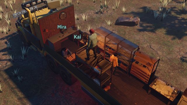 The crew inside the trailer, by the dartboard