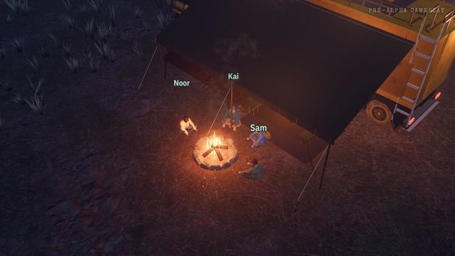 The crew around a campfire at night